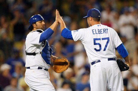 LOS ANGELES, CA - AUGUST 26:  Catcher Rod Barajas #28 and relief pitcher Scott Elbert #57 of the Los Angeles Dodgers celebrate after a 6-1 win over the Colorado Rockies in the MLB game at Dodger Stadium on August 26, 2011 in Los Angeles, California.  <br /><br /><span class="help">(Photo by Victor Decolongon/Getty Images)</span>