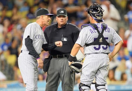 LOS ANGELES, CA - AUGUST 26:  Manager Jim Tracy #4 of the Colorado Rockies makes his case to home plate umpire Hunter Wendelstedt #21 in the seventh inning during the MLB game between the Colorado Rockies and the Los Angeles Dodgers at Dodger Stadium on August 26, 2011 in Los Angeles, California. The Dodgers defeated the Rockies 6-1. <br /><br /><span class="help">(Photo by Victor Decolongon/Getty Images)</span>