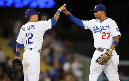 LOS ANGELES, CA - AUGUST 26:  Justin Sellers #12 and Matt Kemp #27 of the Los Angeles Dodgers celebrate after a 6-1 win over the Colorado Rockies during the MLB game at Dodger Stadium on August 26, 2011 in Los Angeles, California.  <br /><br /><span class="help">(Photo by Victor Decolongon/Getty Images)</span>