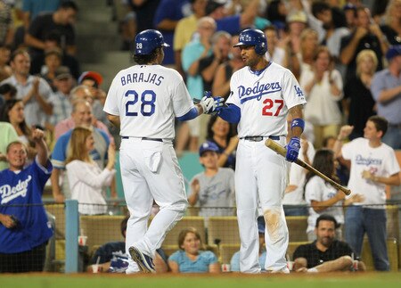 LOS ANGELES, CA - AUGUST 26:  Matt Kemp #27 and Rod Barajas #28 of the Los Angeles Dodgers celebrate in the seventh inning after Barajas scored on a single to right field by Justin Sellers #12 (not in photo) against the Colorado Rockies during the MLB game at Dodger Stadium on August 26, 2011 in Los Angeles, California. The Dodgers defeated the Rockies 6-1. <br /><br /><span class="help">(Photo by Victor Decolongon/Getty Images)</span>
