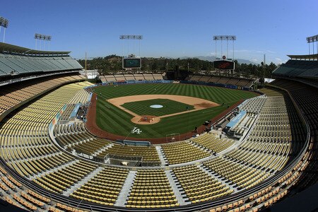 LOS ANGELES, CA - AUGUST 27:  General view of Dodger Stadium as Dodger players warm up in left field and the grounds crew prepares the infield dirt and home plate area before the game between the Colorado Rockies and the Los Angeles Dodgers at Dodger Stadium on August 27, 2011 in Los Angeles, California.  <br /><br /><span class="help">(Photo by Jeff Golden/Getty Images)</span>