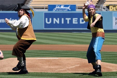 LOS ANGELES, CA - AUGUST 27:  (L-R) Sharky and Bones (Loren Hoskins and Kevin Hendrickson) of Disney Junior’s The Never Land Pirate Band throw out the ceremonial first pitches before the game between the Colorado Rockies and the Los Angeles Dodgers at Dodger Stadium on August 27, 2011 in Los Angeles, California.  <br /><br /><span class="help">(Photo by Jeff Golden/Getty Images)</span>