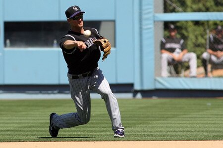 LOS ANGELES, CA - AUGUST 27:  Mark Ellis #14 of the Colorado Rockies fields the ball for the first out in the third inning of the game against the Los Angeles Dodgers at Dodger Stadium on August 27, 2011 in Los Angeles, California.  <br /><br /><span class="help">(Photo by Jeff Golden/Getty Images)</span>