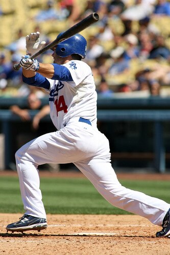 LOS ANGELES, CA - AUGUST 27:  Jamey Carroll #14 of the Los Angeles Dodgers singles against the Colorado Rockies for the first Dodger hit of the game in the third inning at Dodger Stadium on August 27, 2011 in Los Angeles, California.  <br /><br /><span class="help">(Photo by Jeff Golden/Getty Images)</span>