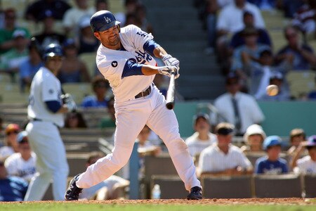 LOS ANGELES, CA - AUGUST 27:  Jamey Carroll #14 of the Los Angeles Dodgers singles in a run against the Colorado Rockies to give the Dodgers a 5-4 lead in the sixth inning at Dodger Stadium on August 27, 2011 in Los Angeles, California.  <br /><br /><span class="help">(Photo by Jeff Golden/Getty Images)</span>
