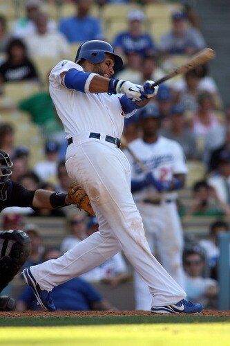LOS ANGELES, CA - AUGUST 27:  James Loney #7 of the Los Angeles Dodgers hits a game-tying home run against the Colorado Rockies in the bottom of the ninth inning at Dodger Stadium on August 27, 2011 in Los Angeles, California.  <br /><br /><span class="help">(Photo by Jeff Golden/Getty Images)</span>
