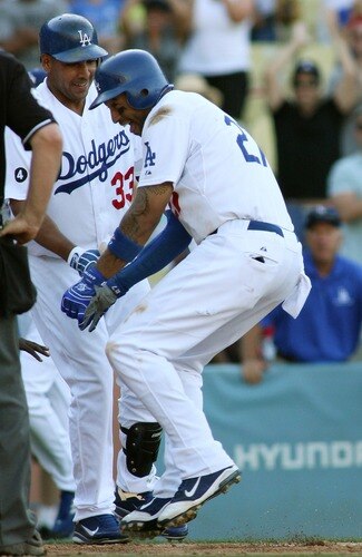 LOS ANGELES, CA - AUGUST 27:  Matt Kemp #27 of the Los Angeles Dodgers celebrates his game-winning solo home run as he touches home plate against the Colorado Rockies in the bottom of the 11th inning at Dodger Stadium on August 27, 2011 in Los Angeles, California.  The Dodgers won 7-6.  <br /><br /><span class="help">(Photo by Jeff Golden/Getty Images)</span>