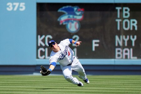 LOS ANGELES, CA - AUGUST 28:  Trent Oeltjen #49 of the Los Angeles Dodgers misses the diving catch at right field in the first inning during the MLB game against the Colorado Rockies at Dodger Stadium on August 28, 2011 in Los Angeles, California.  <br /><br /><span class="help">(Photo by Victor Decolongon/Getty Images)</span>