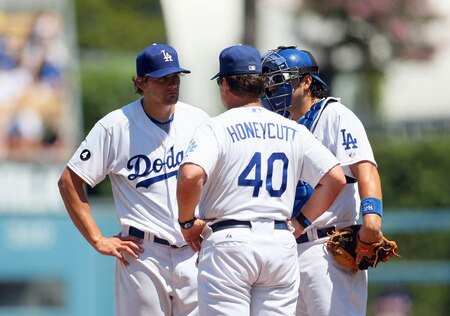 LOS ANGELES, CA - AUGUST 28:  Pitcher Nathan Eovaldi #50 of the Los Angeles listens to pitching coach Rick Honeycutt #40 in the first inning during the MLB game against the Colorado Rockies at Dodger Stadium on August 28, 2011 in Los Angeles, California. Eovaldi gave up five runs in the first inning. <br /><br /><span class="help">(Photo by Victor Decolongon/Getty Images)</span>