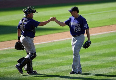 LOS ANGELES, CA - AUGUST 28:  Catcher Eliezer Alfonzo #55 and closing pitcher Rafael Betancourt #63 of the Colorado Rockies celebrate in the infield after defeating the Los Angeles Dodgers 7-6 in the MLB game at Dodger Stadium on August 28, 2011 in Los Angeles, California.  <br /><br /><span class="help">(Photo by Victor Decolongon/Getty Images)</span>