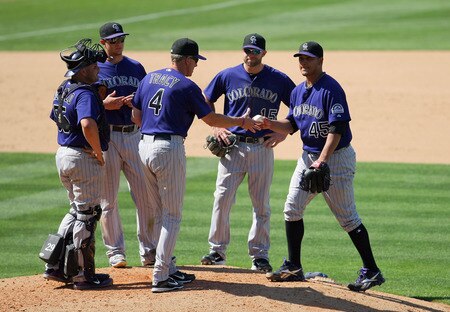 LOS ANGELES, CA - AUGUST 28:  Manager Jim Tracy #4 of the Colorado Rockies takes starting pitcher Jhoulys Chacin #45 out of the game in the sixth inning during the MLB game against the Colorado Rockies at Dodger Stadium on August 28, 2011 in Los Angeles, California. The Rockies defeated the Dodgers 7-6. <br /><br /><span class="help">(Photo by Victor Decolongon/Getty Images)</span>