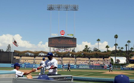 LOS ANGELES, CA - AUGUST 28:  Tony Gwynn Jr. #10 of the Los Angeles Dodgers celebrates scoring with manager Don Mattingly as Gwynn enters the dugout in the first inning during the MLB game against the Colorado Rockies at Dodger Stadium on August 28, 2011 in Los Angeles, California. The Rockies defeated the Dodgers 7-6. <br /><br /><span class="help">(Photo by Victor Decolongon/Getty Images)</span>