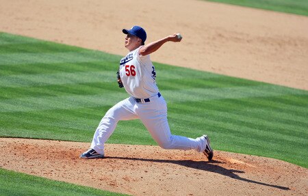 LOS ANGELES, CA - AUGUST 28:  Hong-Chih Kuo #56 of the Los Angeles Dodgers pitches in middle relief in the seventh inning during the MLB game against the Colorado Rockies at Dodger Stadium on August 28, 2011 in Los Angeles, California. The Rockies defeated the Dodgers 7-6.  <br /><br /><span class="help">(Photo by Victor Decolongon/Getty Images)</span>