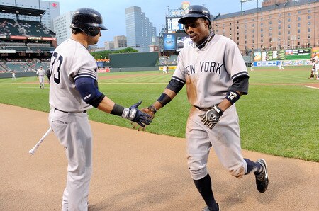 BALTIMORE, MD - AUGUST 29: Curtis Granderson #14 of the New York Yankees celebrates with Nick Swisher #33 after scoring in the first inning against the Baltimore Orioles at Oriole Park at Camden Yards on August 29, 2011 in Baltimore, Maryland.  <br /><br /><span class="help">(Photo by Greg Fiume/Getty Images)</span>