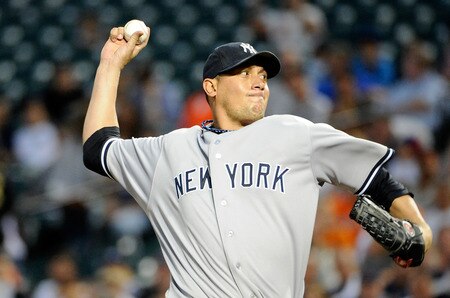 BALTIMORE, MD - AUGUST 29:  Freddy Garcia #36 of the New York Yankees pitches against the Baltimore Orioles at Oriole Park at Camden Yards on August 29, 2011 in Baltimore, Maryland.  <br /><br /><span class="help">(Photo by Greg Fiume/Getty Images)</span>