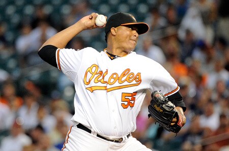 BALTIMORE, MD - AUGUST 29:  Alfredo Simon #55 of the Baltimore Orioles pitches against the New York Yankees at Oriole Park at Camden Yards on August 29, 2011 in Baltimore, Maryland.  <br /><br /><span class="help">(Photo by Greg Fiume/Getty Images)</span>