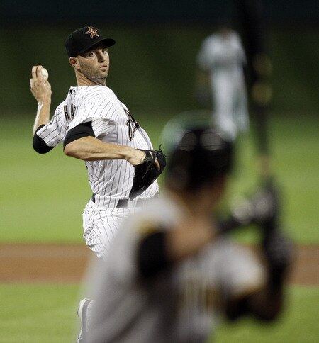 HOUSTON - AUGUST 31:  Pitcher J.A. Happ #30 of the Houston Astros throws against the Pittsburgh Pirates in the first inning at Minute Maid Park on August 31, 2011 in Houston, Texas.  <br /><br /><span class="help">(Photo by Bob Levey/Getty Images)</span>