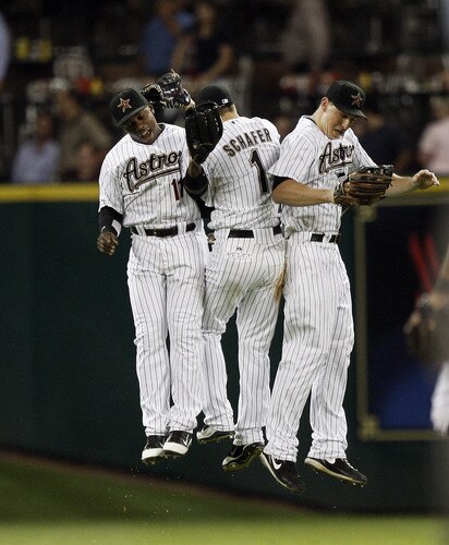 HOUSTON - AUGUST 31:  Jason Bourgeois #11m Jordan Schafer #1 and Brian Bogusevic #19 of the Houston Astros celebrate after the final out against the Pittsburgh Pirates at Minute Maid Park on August 31, 2011 in Houston, Texas. Houston won 2-0. <br /><br /><span class="help">(Photo by Bob Levey/Getty Images)</span>
