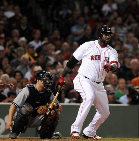 BOSTON, MA - SEPTEMBER 1:  David Ortiz #34 of the Boston Red Sox gets a hit in the second inning as catcher Russell Martin #55 of the New York Yankees looks on at Fenway Park on September 1, 2011 in Boston, Massachusetts. <br /><br /><span class="help">(Photo by Darren McCollester/Getty Images)</span>
