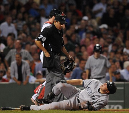 BOSTON, MA - SEPTEMBER 1: Mark Teixeira # 25 of the New York Yankees gets hit by a pitch in the sixth inning against the Boston Red Sox at Fenway Park on September 1, 2011 in Boston, Massachusetts. <br /><br /><span class="help">(Photo by Darren McCollester/Getty Images)</span>