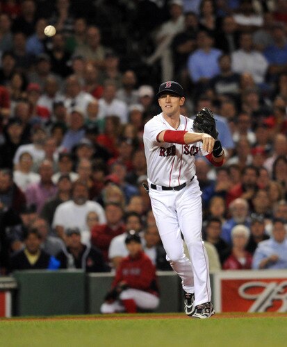 BOSTON, MA - SEPTEMBER 1:  Jed Lowrie #12 of the Boston Red Sox throws to first base for the out in the sixth inning against the New York Yankees at Fenway Park on September 1, 2011 in Boston, Massachusetts. <br /><br /><span class="help">(Photo by Darren McCollester/Getty Images)</span>
