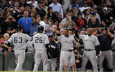 BOSTON, MA - SEPTEMBER 1:  Jesus Montero #63 of the New York Yankees is congratulated by teammates after scoring on a two run hit by Russell Martin #55 in the seventh inning against the Boston Red Sox at Fenway Park on September 1, 2011 in Boston, Massachusetts. <br /><br /><span class="help">(Photo by Darren McCollester/Getty Images)</span>