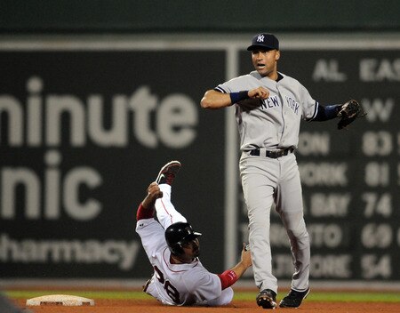 BOSTON, MA - SEPTEMBER 1:  Derek Jeter #2 of the New York Yankees throws to first after forcing out Adrian Gonzalez #28 of the Boston Red Sox during eighth inning action at Fenway Park on September 1, 2011 in Boston, Massachusetts. <br /><br /><span class="help">(Photo by Darren McCollester/Getty Images)</span>