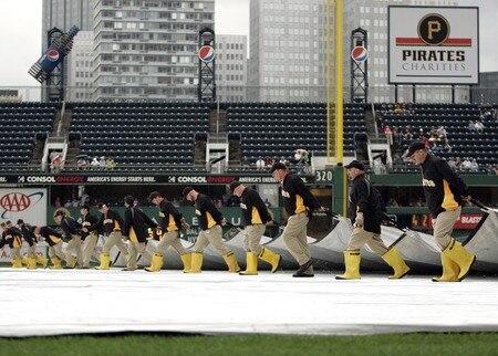 PITTSBURGH, PA - SEPTEMBER 05:  The Pirates field crew removes the tarp before the start of play between the Pittsburgh Pirates and the Houston Astros on September 5, 2011 at PNC Park in Pittsburgh, Pennsylvania.  <br /><br /><span class="help">(Photo by Justin K. Aller/Getty Images)</span>