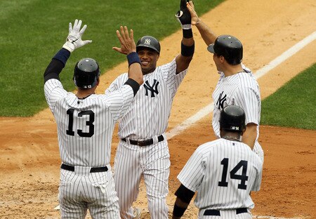 NEW YORK, NY - SEPTEMBER 05:  Robinson Cano #24 of the New York Yankees celebrates his second inning grand slam against the Baltimore Orioles with teammates Alex Rodriguez #13, Mark Teixeira #25 and Curtis Granderson #14 on September 5, 2011 at Yankee Stadium in the Bronx borough of New York City.  <br /><br /><span class="help">(Photo by Jim McIsaac/Getty Images)</span>