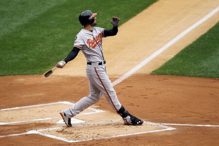 NEW YORK, NY - SEPTEMBER 05:  Nick Markakis #21 of the Baltimore Orioles follows through on a first inning home run against the New York Yankees on September 5, 2011 at Yankee Stadium in the Bronx borough of New York City.  <br /><br /><span class="help">(Photo by Jim McIsaac/Getty Images)</span>