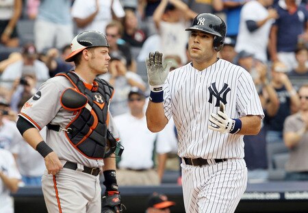 NEW YORK, NY - SEPTEMBER 05:  Jesus Montero #63 of the New York Yankees celebrates his fifth inning home run as Matt Wieters #32 of the Baltimore Orioles looks on at Yankee Stadium on September 5, 2011 in the Bronx borough of New York City. The home run was the first in the major leagues for Montero.  <br /><br /><span class="help">(Photo by Jim McIsaac/Getty Images)</span>