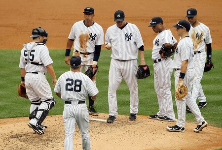 NEW YORK, NY - SEPTEMBER 05:  Freddy Garcia #36 (C) of the New York Yankees is removed from the game against the Baltimore Orioles by manager Joe Girardi in nthe third inningon September 5, 2011 at Yankee Stadium in the Bronx borough of New York City.  <br /><br /><span class="help">(Photo by Jim McIsaac/Getty Images)</span>