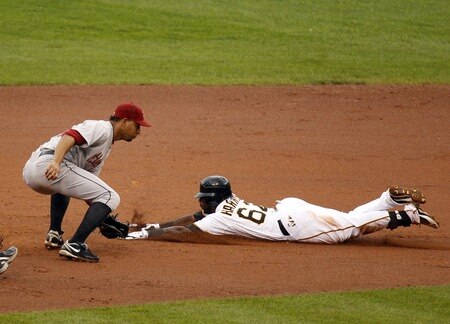 PITTSBURGH, PA - SEPTEMBER 05:  Josh Harrison #62 of the Pittsburgh Pirates slides into second safe against Angel Sanchez #36 of the Houston Astros during the game on September 5, 2011 at PNC Park in Pittsburgh, Pennsylvania.  <br /><br /><span class="help">(Photo by Justin K. Aller/Getty Images)</span>
