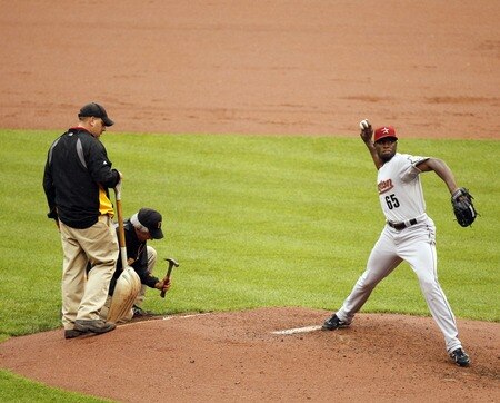 PITTSBURGH, PA - SEPTEMBER 05:  The PNC Park ground crew works on the pitchers mound as Henry Sosa #65 of the Houston Astros warms up against the Pittsburgh Pirates during the game on September 5, 2011 at PNC Park in Pittsburgh, Pennsylvania.  <br /><br /><span class="help">(Photo by Justin K. Aller/Getty Images)</span>