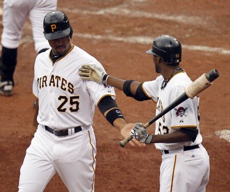 PITTSBURGH, PA - SEPTEMBER 05:  Derrek Lee #25 of the Pittsburgh Pirates celebrates scoring on a RBI double by Josh Harrison #62 (not pictured) against the Houston Astros during the game on September 5, 2011 at PNC Park in Pittsburgh, Pennsylvania.  <br /><br /><span class="help">(Photo by Justin K. Aller/Getty Images)</span>