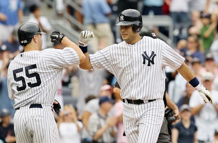 NEW YORK, NY - SEPTEMBER 05:  Jesus Montero #63 of the New York Yankees celebrates his seventh inning two run home run against the Baltimore Orioles with teammate Russell Martin #55 on September 5, 2011 at Yankee Stadium in the Bronx borough of New York City. It was montero's second home run of the game.  <br /><br /><span class="help">(Photo by Jim McIsaac/Getty Images)</span>