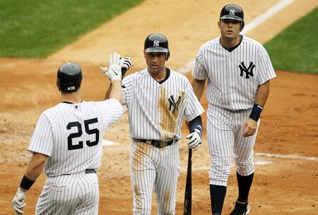 NEW YORK, NY - SEPTEMBER 05:  Derek Jeter #2 (C) and Jesus Montero #63 of the New York Yankees celebrate with teammate Mark Teixeira #25 after scoring in the second inning against the Baltimore Orioles on September 5, 2011 at Yankee Stadium in the Bronx borough of New York City.  <br /><br /><span class="help">(Photo by Jim McIsaac/Getty Images)</span>