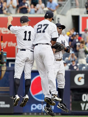 NEW YORK, NY - SEPTEMBER 05: Brett Gardner #11, Chris Dickerson #27 and Curtis Granderson #14 of the New York Yankees celebrate after defeating the Baltimore Orioles on September 5, 2011 at Yankee Stadium in the Bronx borough of New York City.  <br /><br /><span class="help">(Photo by Jim McIsaac/Getty Images)</span>