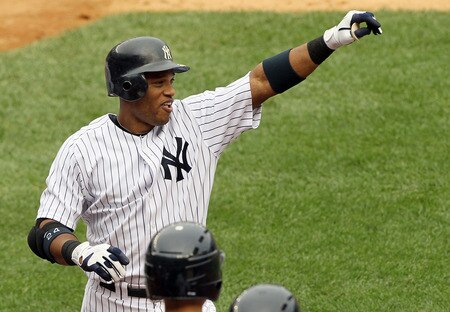 NEW YORK, NY - SEPTEMBER 05:  Robinson Cano #24 of the New York Yankees celebrates his second inning grand slam against the Baltimore Orioles on September 5, 2011 at Yankee Stadium in the Bronx borough of New York City.  <br /><br /><span class="help">(Photo by Jim McIsaac/Getty Images)</span>