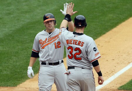 NEW YORK, NY - SEPTEMBER 05:  Mark Reynolds #12 of the Baltimore Orioles celebrates his third inning two run home run against the New York Yankees with teammate Matt Wieters #32 on September 5, 2011 at Yankee Stadium in the Bronx borough of New York City.  <br /><br /><span class="help">(Photo by Jim McIsaac/Getty Images)</span>