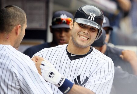 NEW YORK, NY - SEPTEMBER 05:  Jesus Montero #63 of the New York Yankees celebrates his seventh-inning two-run home run against the Baltimore Orioles on September 5, 2011 at Yankee Stadium in the Bronx borough of New York City. It was montero's second home run of the game.  <br /><br /><span class="help">(Photo by Jim McIsaac/Getty Images)</span>