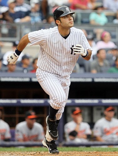 NEW YORK, NY - SEPTEMBER 05:  Jesus Montero #63 of the New York Yankees watches the flight of his fifth-inning home run against the Baltimore Orioles on September 5, 2011 at Yankee Stadium in the Bronx borough of New York City. The blast was the first in the major leagues for Montero.  <br /><br /><span class="help">(Photo by Jim McIsaac/Getty Images)</span>
