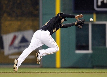 PITTSBURGH, PA - SEPTEMBER 06:  Neil Walker #18 of the Pittsburgh Pirates can't field a ground ball against the Houston Astros during the game on September 6, 2011 at PNC Park in Pittsburgh, Pennsylvania.  <br /><br /><span class="help">(Photo by Justin K. Aller/Getty Images)</span>