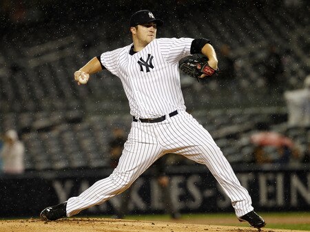 NEW YORK - SEPTEMBER 06:  Phil Hughes #65 of the New York Yankees delivers during a game against the Baltimore Orioles at Yankee Stadium on September 6, 2011 in the Bronx Borough of New York City.  <br /><br /><span class="help">(Photo by Jeff Zelevansky/Getty Images)</span>