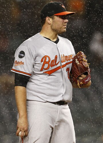 NEW YORK - SEPTEMBER 06:  Tommy Hunter #39 of the Baltimore Orioles delivers during a game against the New York Yankees at Yankee Stadium on September 6, 2011 in the Bronx Borough of New York City.  <br /><br /><span class="help">(Photo by Jeff Zelevansky/Getty Images)</span>