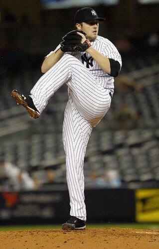 NEW YORK - SEPTEMBER 06:  Phil Hughes #65 of the New York Yankees delivers during a game against the Baltimore Orioles at Yankee Stadium on September 6, 2011 in the Bronx Borough of New York City.  <br /><br /><span class="help">(Photo by Jeff Zelevansky/Getty Images)</span>