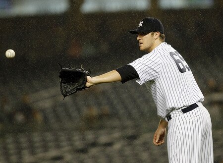 NEW YORK - SEPTEMBER 06:  Phil Hughes #65 of the New York Yankees gets the ball back during a game against the Baltimore Orioles at Yankee Stadium on September 6, 2011 in the Bronx Borough of New York City.  <br /><br /><span class="help">(Photo by Jeff Zelevansky/Getty Images)</span>