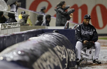 NEW YORK - SEPTEMBER 06:  A ballboy sits during a rain delay in a game between the Baltimore Orioles and the New York Yankees at Yankee Stadium on September 6, 2011 in the Bronx Borough of New York City.  <br /><br /><span class="help">(Photo by Jeff Zelevansky/Getty Images)</span>