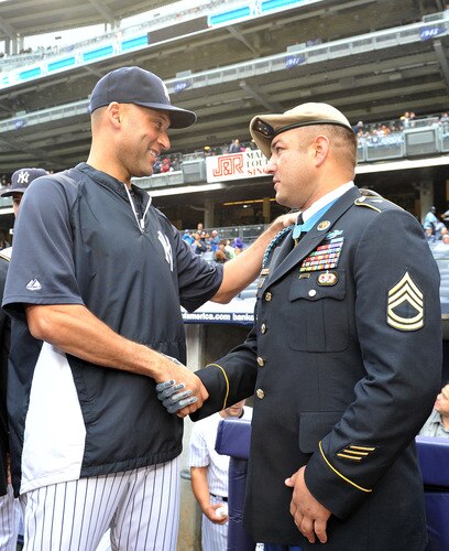 NEW YORK, NY - SEPTEMBER 07: Derek Jeter #2 of the New York Yankees (L) shakes hands with Metal of Honor recipient Leroy Petry during a pregame ceremony commemorating the Tenth Anniversary of the September 11th attacks on September 7, 2011 at Yankee Stadium in the Bronx borough of New York City. <br /><br /><span class="help">(Photo by Christopher Pasatieri/Getty Images)</span>