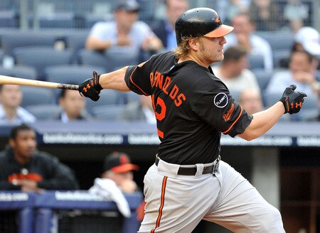 NEW YORK, NY - SEPTEMBER 07: Mark Reynolds #12 of the Baltimore Orioles connects for what would be the game winning single in the top of the eleventh inning against the New York Yankees on September 7, 2011 at Yankee Stadium in the Bronx borough of New York City. <br /><br /><span class="help">(Photo by Christopher Pasatieri/Getty Images)</span>